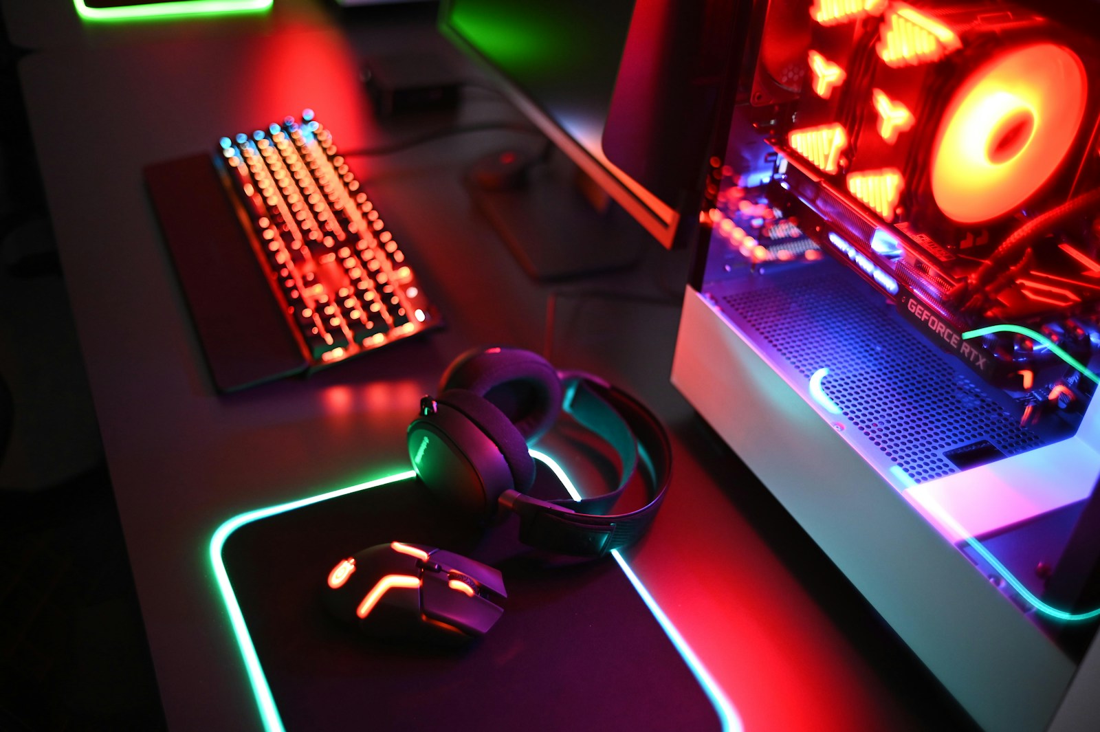 Gamer setup with mechanical keyboard and lit mouse