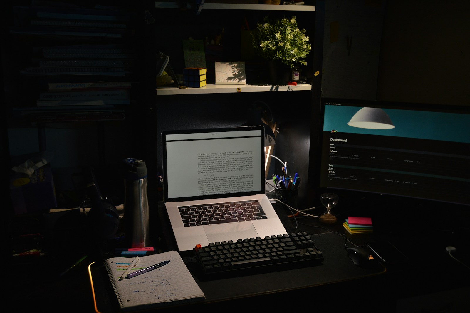 Dark room with gamer setup and neon lights